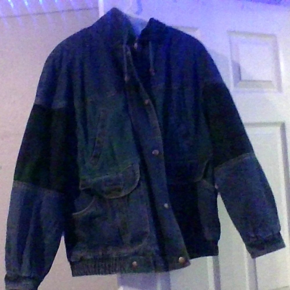 denim jacket with flanel design on inside and on patches of it